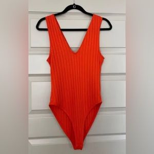 Zara body suit - vibrant orange with buttons at the bottom